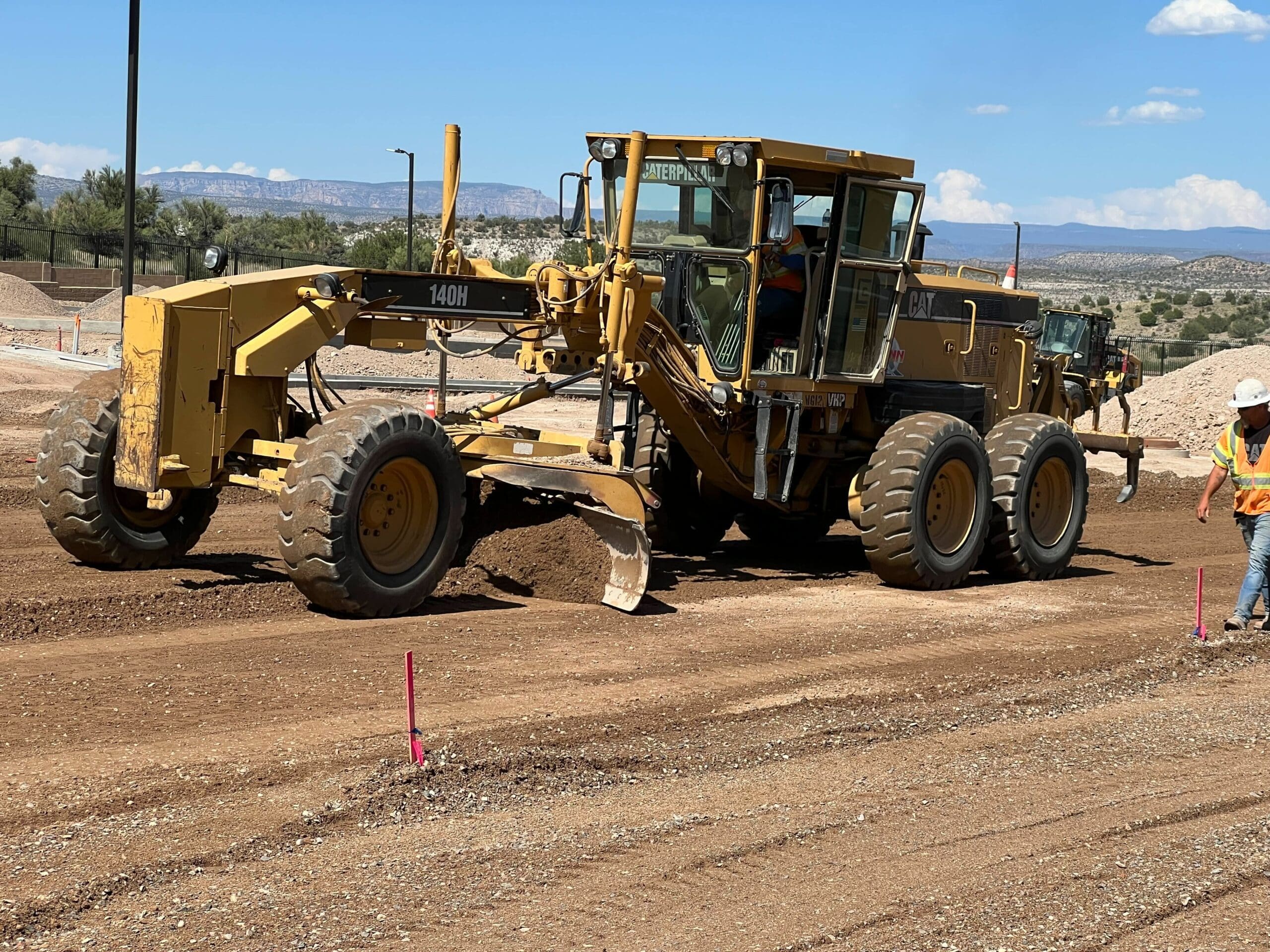 A bulldozer on a dirt road.